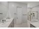 Modern bathroom with double vanity and soaking tub at 11870 Star Grass Ave, Las Vegas, NV 89138