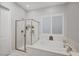 Bathroom features a soaking tub, walk-in shower, and updated vanity at 11870 Star Grass Ave, Las Vegas, NV 89138