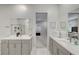 Elegant bathroom with double vanity and view of bedroom at 11870 Star Grass Ave, Las Vegas, NV 89138