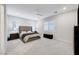 Spacious bedroom with plush bed and large windows at 11870 Star Grass Ave, Las Vegas, NV 89138