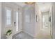 Bright entryway with tiled floors and a modern chandelier at 11870 Star Grass Ave, Las Vegas, NV 89138