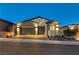 Stunning curb appeal with a two-car garage and well-manicured landscaping at 11870 Star Grass Ave, Las Vegas, NV 89138