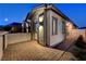 View of the home's exterior, showing a side entrance and patio at 11870 Star Grass Ave, Las Vegas, NV 89138