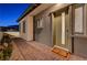 Modern front entry with a green door and brick walkway at 11870 Star Grass Ave, Las Vegas, NV 89138