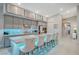 Modern kitchen with gray cabinets, quartz countertops and stainless steel appliances at 11870 Star Grass Ave, Las Vegas, NV 89138