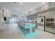 Modern kitchen with large island and stainless steel appliances at 11870 Star Grass Ave, Las Vegas, NV 89138