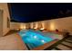 Luxury pool with fire features and spa at night at 11870 Star Grass Ave, Las Vegas, NV 89138