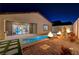 Luxury pool and patio with outdoor fireplace at 11870 Star Grass Ave, Las Vegas, NV 89138