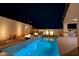 Relaxing pool with a fire pit and seating area at 11870 Star Grass Ave, Las Vegas, NV 89138