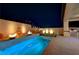 Night view of a beautiful pool and patio area at 11870 Star Grass Ave, Las Vegas, NV 89138