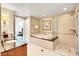 Bathroom with soaking tub, shower, and vanity with a view at 125 E Harmon Ave # 1620, Las Vegas, NV 89109