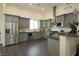 Modern kitchen with gray cabinets, granite countertops, and stainless steel appliances at 1409 Denver St, Boulder City, NV 89005