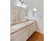 Bathroom with granite double vanity and hardwood floors at 1420 Ellen Tracy Way, Henderson, NV 89014