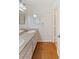 Double sink bathroom with granite countertop and wood floors at 1420 Ellen Tracy Way, Henderson, NV 89014