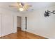 Bright bedroom with wood floors, double doors, and ceiling fan at 1420 Ellen Tracy Way, Henderson, NV 89014