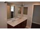 Double vanity bathroom with dark wood cabinets and a large mirror at 150 N Las Vegas Blvd # 1217, Las Vegas, NV 89101