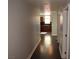 Long hallway with dark hardwood floors and neutral-colored walls at 150 N Las Vegas Blvd # 1217, Las Vegas, NV 89101