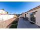 Landscaped backyard with patio and seating area at 162 Windy Creek Ave, Las Vegas, NV 89123