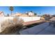 Landscaped backyard with patio and seating area at 162 Windy Creek Ave, Las Vegas, NV 89123