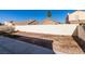 Large backyard with gravel and a block wall at 162 Windy Creek Ave, Las Vegas, NV 89123