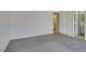 Bright bedroom with grey carpet and access to bathroom at 162 Windy Creek Ave, Las Vegas, NV 89123