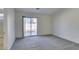 Bright bedroom with grey carpet and sliding glass door to backyard at 162 Windy Creek Ave, Las Vegas, NV 89123