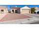 Front view of a house with a gravel yard and driveway at 162 Windy Creek Ave, Las Vegas, NV 89123