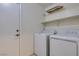 Laundry room with washer, dryer and shelving at 162 Windy Creek Ave, Las Vegas, NV 89123