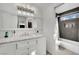 Bathroom with white vanity, marble countertop and shower/tub combo at 1627 Candice St, Las Vegas, NV 89156