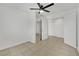 Bright bedroom with tile floors, ceiling fan and double door closet at 1627 Candice St, Las Vegas, NV 89156