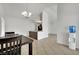 Bright dining area with dark wood table and chairs, kitchen access, and water dispenser at 1627 Candice St, Las Vegas, NV 89156