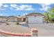 Single-story home with a two-car garage and gravel landscaping at 1627 Candice St, Las Vegas, NV 89156