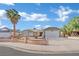 Single-story house with a two-car garage and landscaped front yard at 1627 Candice St, Las Vegas, NV 89156