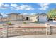 Single-story house with a two-car garage and nicely landscaped front yard at 1627 Candice St, Las Vegas, NV 89156