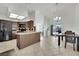 Kitchen with an island, dark cabinets, and tile floors at 1627 Candice St, Las Vegas, NV 89156