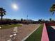 Backyard with artificial turf and stone pathway at 1761 Augusta St, Pahrump, NV 89048