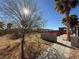 Landscaped backyard with pathway and pergola at 1761 Augusta St, Pahrump, NV 89048