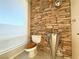 Stylish powder room with stone wall and modern sink at 1761 Augusta St, Pahrump, NV 89048