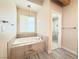 Relaxing bathroom with soaking tub and walk-in shower at 1761 Augusta St, Pahrump, NV 89048