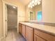 Bathroom with light wood cabinets and granite countertop at 1761 Augusta St, Pahrump, NV 89048