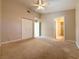 Bright bedroom with carpeted floor and ceiling fan at 1761 Augusta St, Pahrump, NV 89048