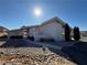 Ranch style home with a walkway leading to the entrance at 1761 Augusta St, Pahrump, NV 89048