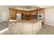 Large kitchen boasts a sizable island and extensive granite counter space at 1761 Augusta St, Pahrump, NV 89048