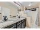 Bathroom boasts a double vanity with granite countertop at 2108 Royal Antilles Ct, North Las Vegas, NV 89031