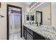 Bathroom with double vanity, granite countertop, and separate tub and shower at 2108 Royal Antilles Ct, North Las Vegas, NV 89031