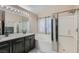 Main bathroom with double sinks, granite, and soaking tub at 2108 Royal Antilles Ct, North Las Vegas, NV 89031