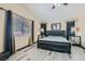 Main bedroom with wood-look floors and ceiling fan at 2108 Royal Antilles Ct, North Las Vegas, NV 89031