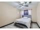 Bedroom with ceiling fan and gray upholstered bed at 2108 Royal Antilles Ct, North Las Vegas, NV 89031