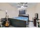 Bedroom with a king-size bed, ceiling fan, and hardwood floor at 2108 Royal Antilles Ct, North Las Vegas, NV 89031