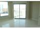 Bright bedroom with tile floors, large windows, and sliding door to balcony at 222 Karen Ave # 2708, Las Vegas, NV 89109